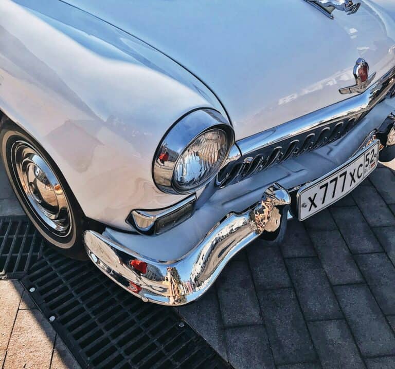 silver mercedes benz car on brown brick floor